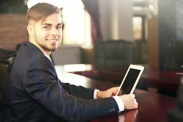 Sticker - Businessman working with tablet in office