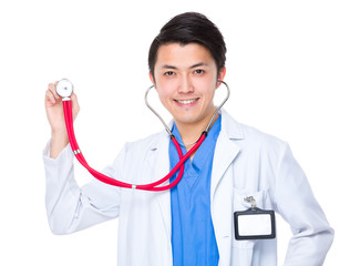 Wall Mural - Doctor holding stethoscope up