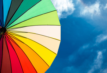 colorful umbrella segments on blue sky