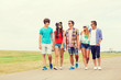 © Syda Productions - group of smiling teenagers walking outdoors