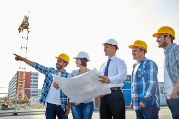 Poster - group of builders and architects with blueprint