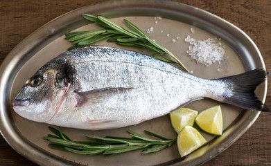 Sticker - Fresh dorada with ingredients on the vintage tray