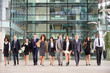 © Monkey Business - Large group of business people in lobby of a big business