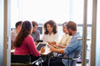 © Monkey Business - Casually dressed colleagues talking in a meeting room