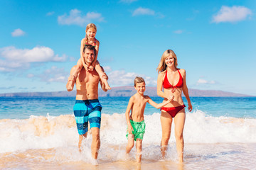 Happy Family Having Fun on the Beach