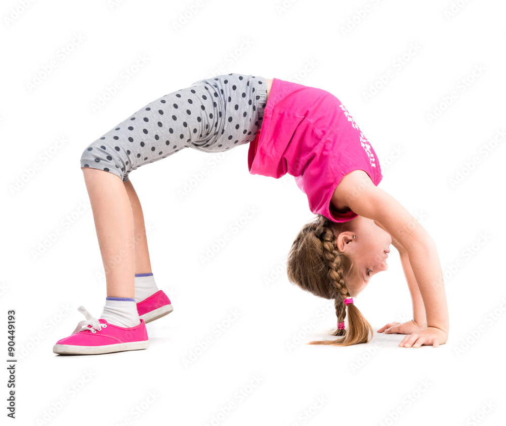 little girl doing the bridge exercise Stock Photo | Adobe Stock