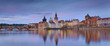 Prague Panorama. Panoramic image of Prague riverside and Charles Bridge, with reflection of the city in Vltava River.