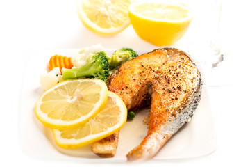 Wall Mural - Grilled salmon and vegetables on white