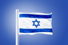 Flag Of Israel Flying Against A Blue Sky