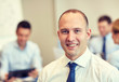 © Syda Productions - group of smiling businesspeople meeting in office