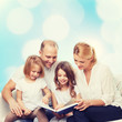 © Syda Productions - happy family with book at home
