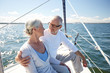 © Syda Productions - senior couple hugging on sail boat or yacht in sea