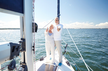 Poster - senior couple hugging on sail boat or yacht in sea