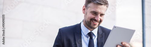 Fotografía Happy businessperson with tablet