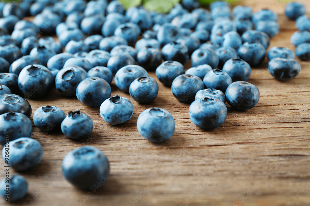 Fresh blueberries on wooden table, closeup