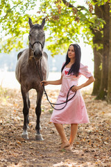 Wall Mural - Young woman with a horse