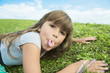 © Louis-Paul Photo - Beautiful portrait of a little girl outside on grass