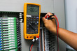 Digital multimeter checking voltage