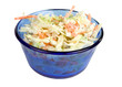 Coleslaw in Blue Bowl – Fresh coleslaw salad, with carrots, cabbage, and coleslaw dressing, in a blue glass bowl. On a white background.