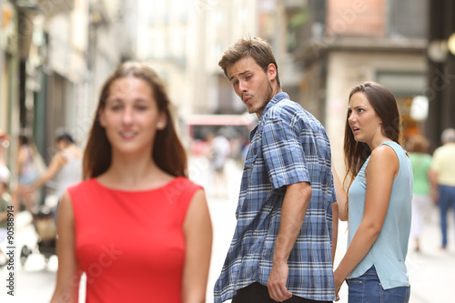 Cuadros en Lienzo Disloyal man with his girlfriend looking at another girl