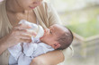 © Odua Images - cute newborn baby being fed by her mother using bottle