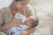 © Odua Images - cute newborn baby being fed by her mother using bottle