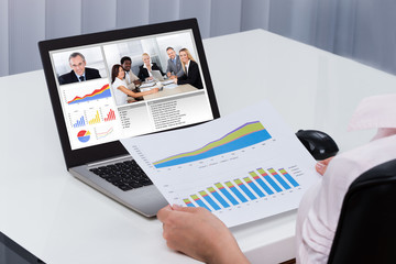 Businessperson Videoconferencing On Laptop