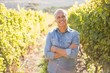© Wavebreak Media - Happy vintner with crossed arms
