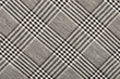 Black and white houndstooth pattern in squares. Black and white wool twill pattern. Woven dogstooth check design as background.