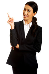 Poster - Businesswoman pointing at copyspace