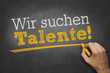 © Torbz - Hand schreibt mit Kreide Text auf Tafel - Wir suchen Talente!