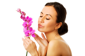 Wall Mural - Topless woman with purple orchid branch