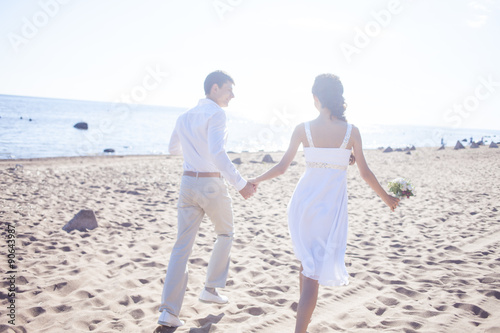 Just Married Hy Running On A Sandy Beach This Stock Just Married Hy Running On A Sandy Beach