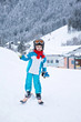 © Tomsickova - Adorable little boy with blue jacket and a helmet, skiing
