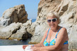 Woman on the deck of trimaran at Costa Brava coast.