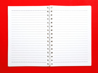 blank ring book on red background