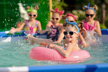 Wall Mural - Portrait of children on the pool in summer