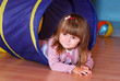 Two-year old girl playing and learning in preschool
