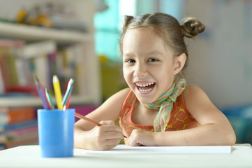Wall Mural - little girl drawing at home