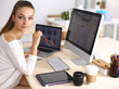© shefkate - Young woman working in office, sitting at desk