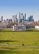 LONDON, UK - APRIL 14, 2015: Canary Wharf view from the Greenwich hill. Modern skyscrapers of banking aria