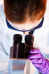 Poster - Life science researcher microscoping in the laboratory.