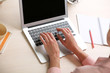 © Africa Studio - Woman using laptop on workplace close up