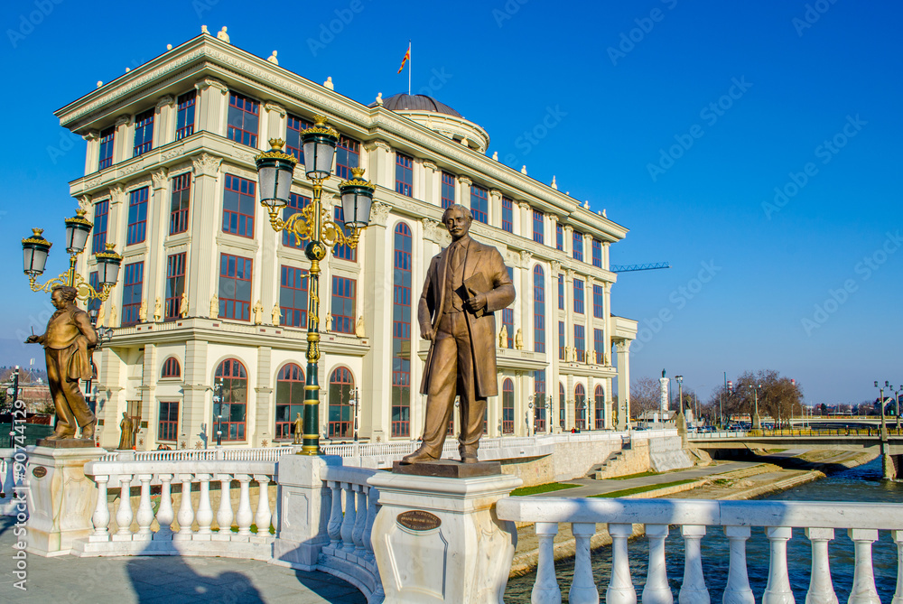 Obraz na płótnie bridge leading towards the Ministry of Foreign Affairs and the Financial Police in skopje is decorated by many statues related to history of macedonia, fyrom. w salonie