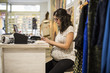 © FotoAndalucia - Pregnant woman working in clothes store
