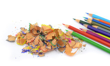 Shavings From Multicolored Pencils On White Background