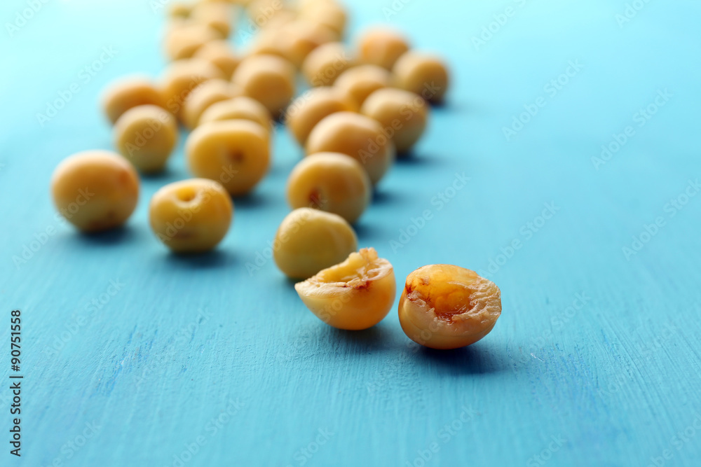 Ripe cherry-plums on wooden table close up