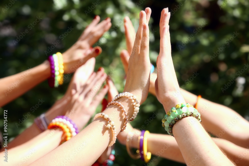 Group of young people hands outdoors