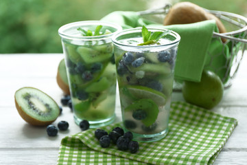 Canvas Print - Kiwi and Blueberry cocktails on wooden background