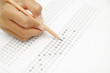 © somkanokwan - Standardized test form with answers bubbled in and a pencil, foc